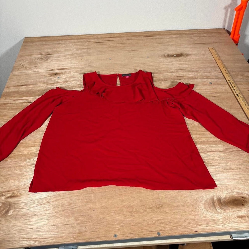 Red Vince Camuto cold shoulder top with ruffle detail. Size: L